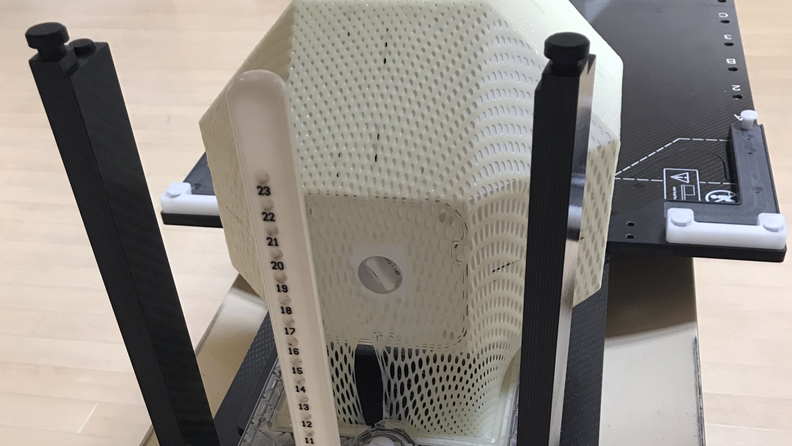 SYSTEM QA RUBY phantom with SYSTEM QA insert and SRS mask set up on CT couch